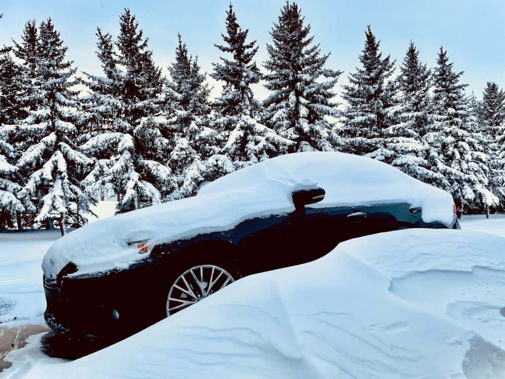 Car covered in snow.