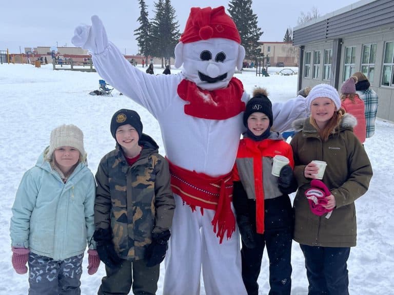 Students at Ardrossan Elementary enjoy the festivities with the Bonhomme Carnaval mascot at the school’s Winter Carnaval.