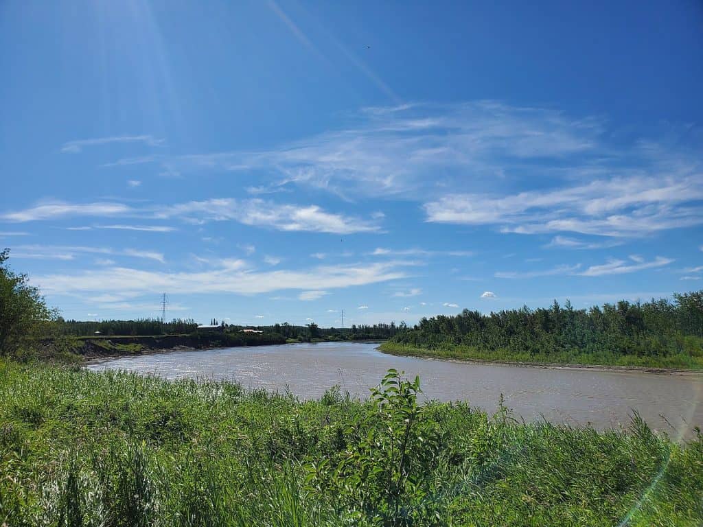 The North Saskatchewan River flowing past the West River's Edge park in Fort Saskatchewan, Alberta