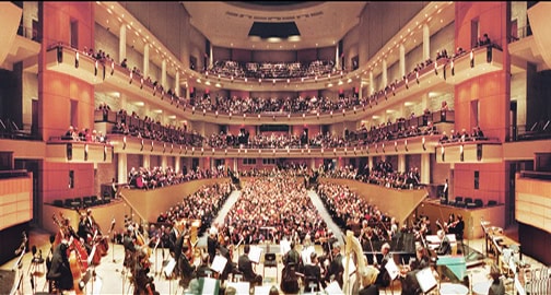 A publicity photo of the Edmonton Symphony Orchestra on stage at the Winspear Centre prior to performance.