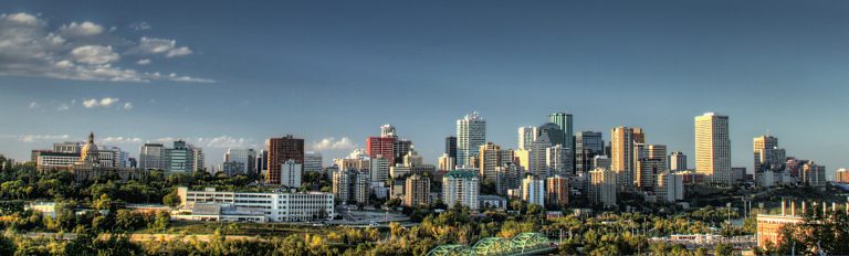 An image of Edmonton's skyline with sunny skies