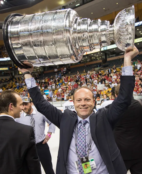 Stan Bowman lifting the Stanley Cup