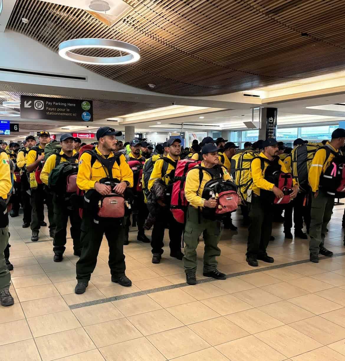 Mexican firefighters arrive in Edmonton airport. courtesy of yegwave on Instagram