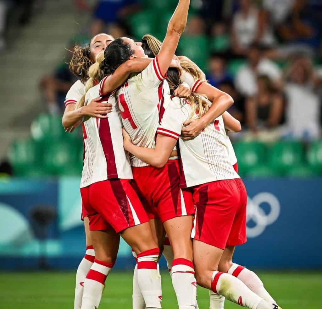 Canada Soccer Team Hug> COurtesy of Vanessa Gilles on Instagram