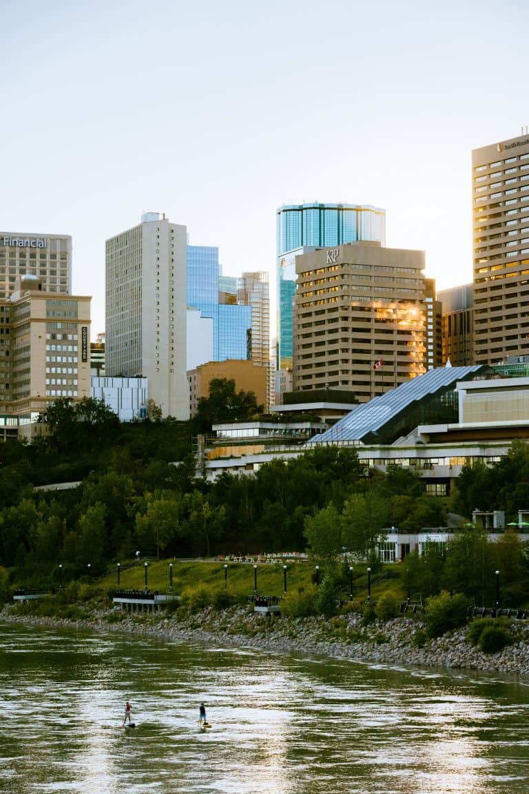 Downtown skyline with paddle boarder on the river
