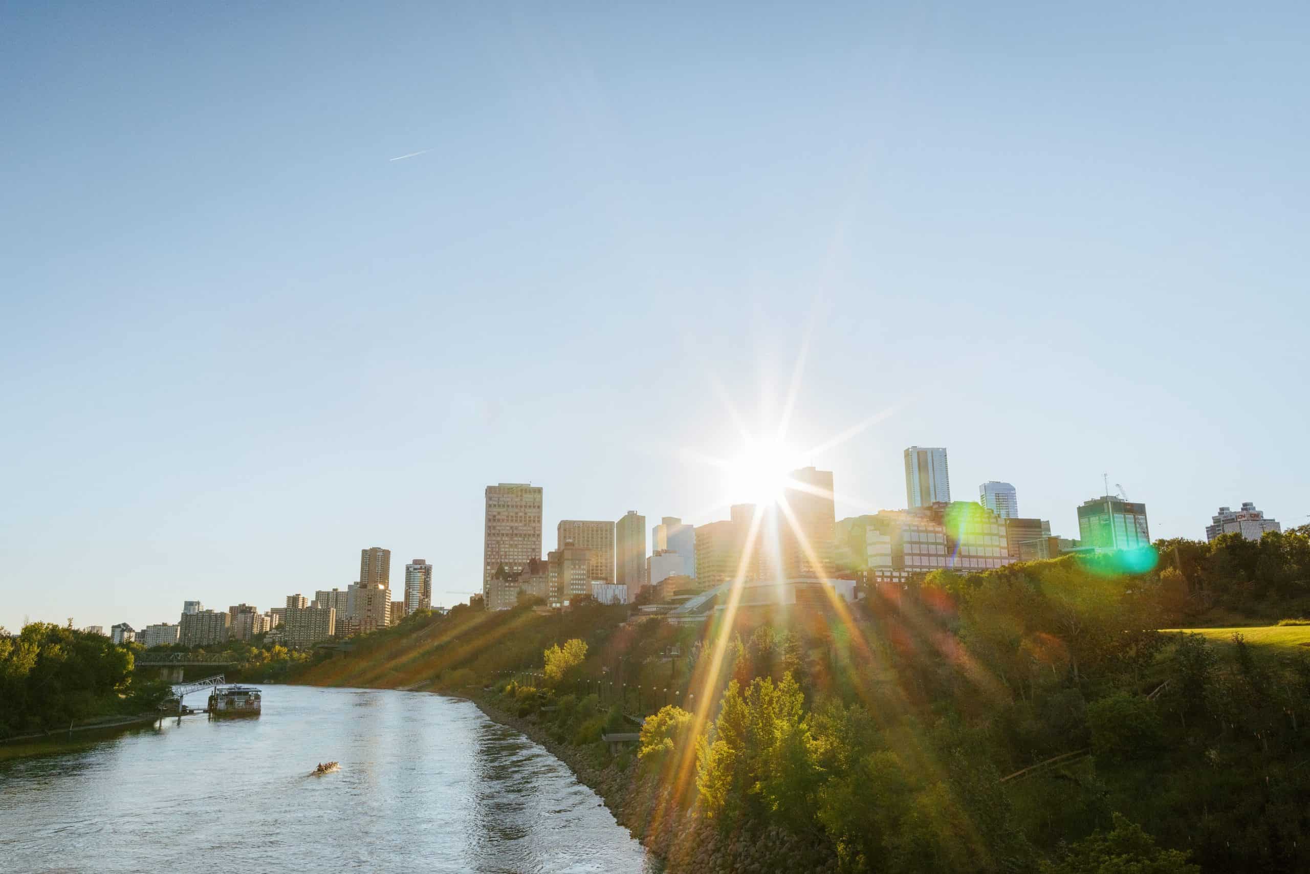 Downtown Edmonton skyline with sunburst