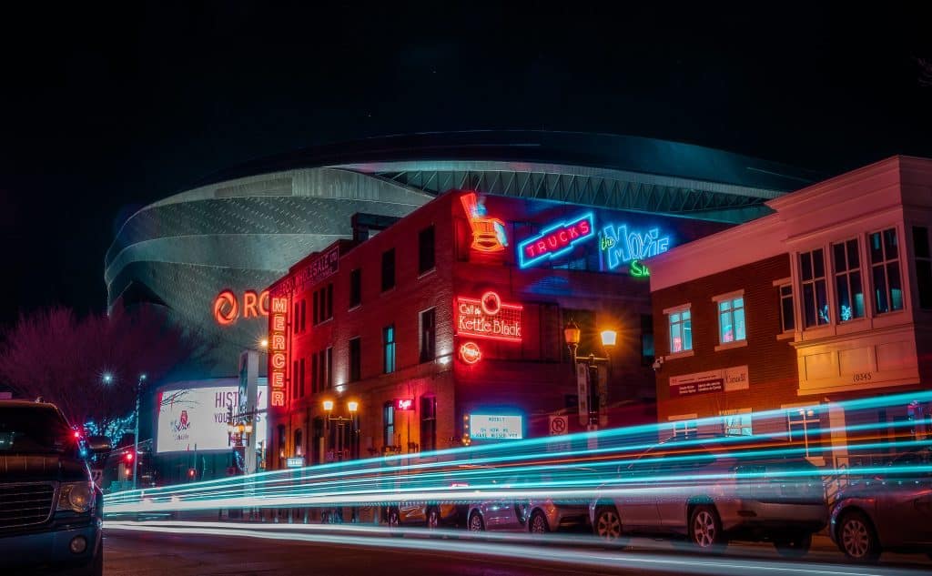 Neon Sign Museum at night with Rogers Place in the background