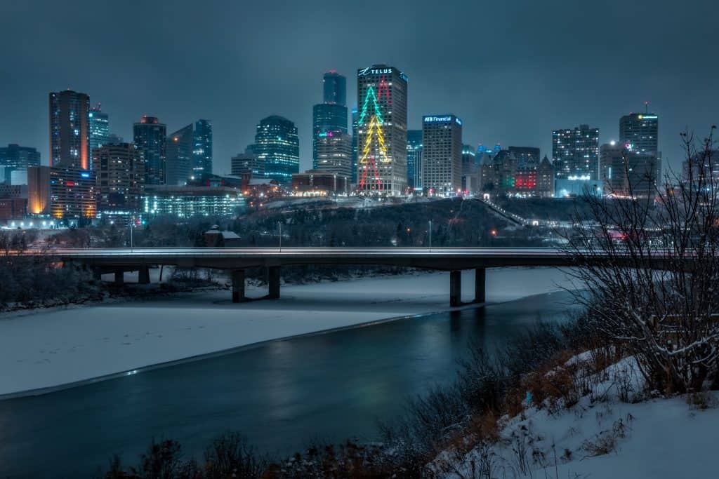 Edmonton skyline at night in winter with river in the foreground