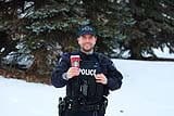 Photo provided by RCMP Alberta Coffee with a Cop Police Officer holding a coffee